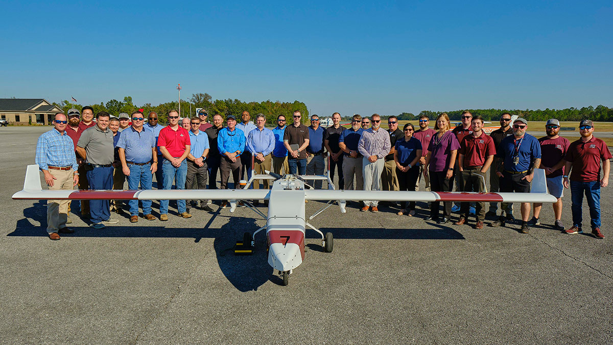 Southern Company and MSU representatives stand with TigerShark.