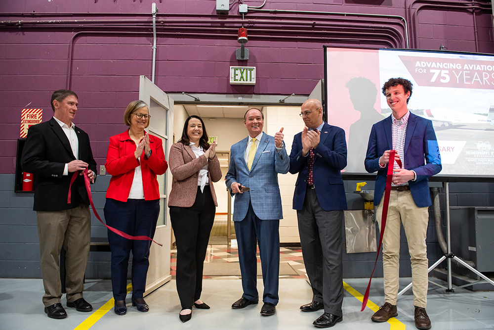 MSU leaders cut the ribbon on Raspet Flight Research Lab’s newly renovated office space. Pictured, from left, is Raspet Associate Director Edward McGinnis, MSU Vice President for Research and Economic Development Julie Jordan, Appalachian Regional Commission Mississippi Director Andrea Rose, MSU President Mark E. Keenum, Raspet Director Rob Premo, and Raspet Aviation Research Engineer Brady Swann. (Photo by Grace Cockrell)