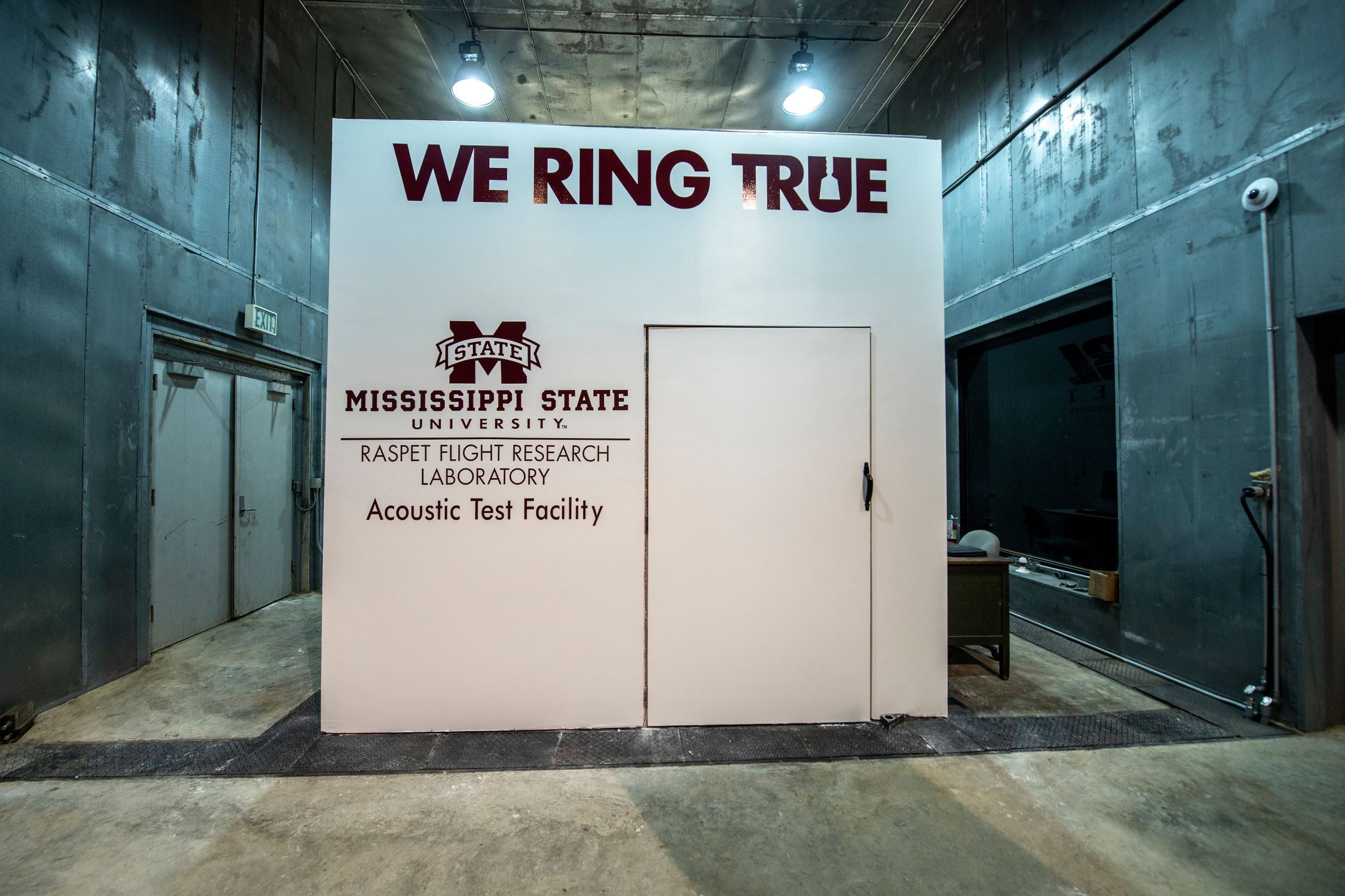 An exterior view of an anechoic chamber outfitted with MSU Raspet signage. 